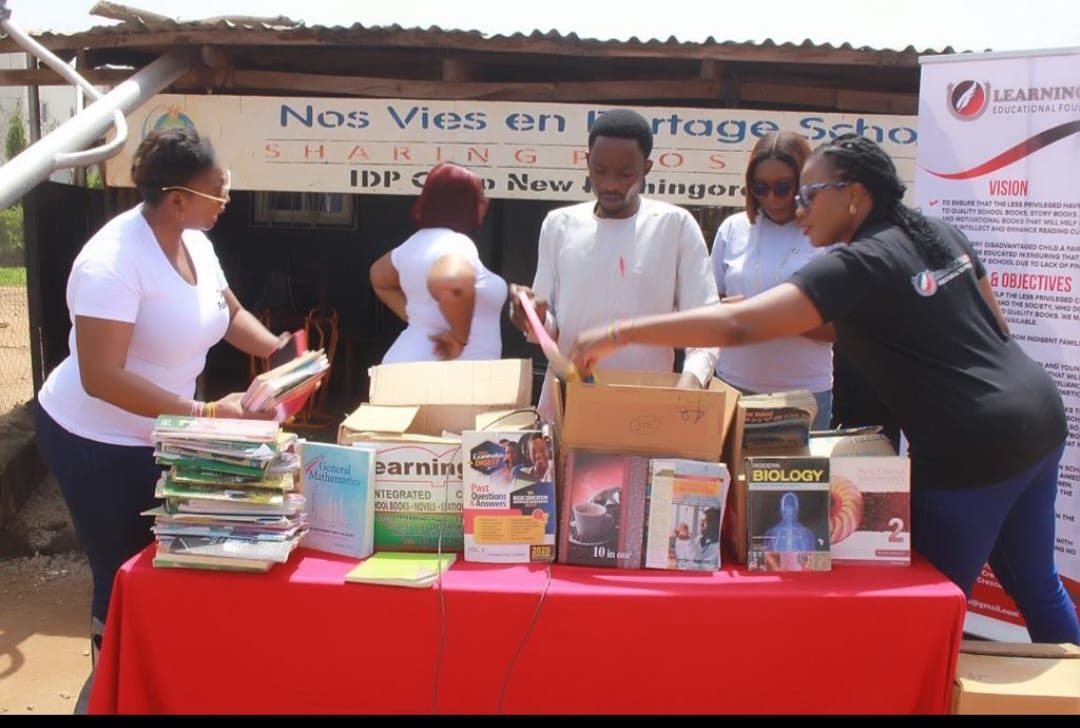 Books being unpacked from cartons at the New Kuchigoro outreach.
